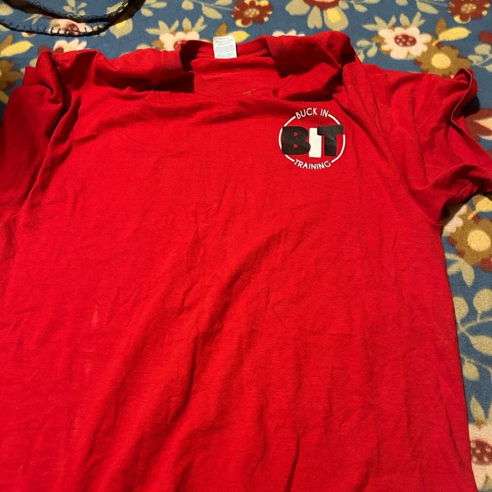 red buck in training shirt